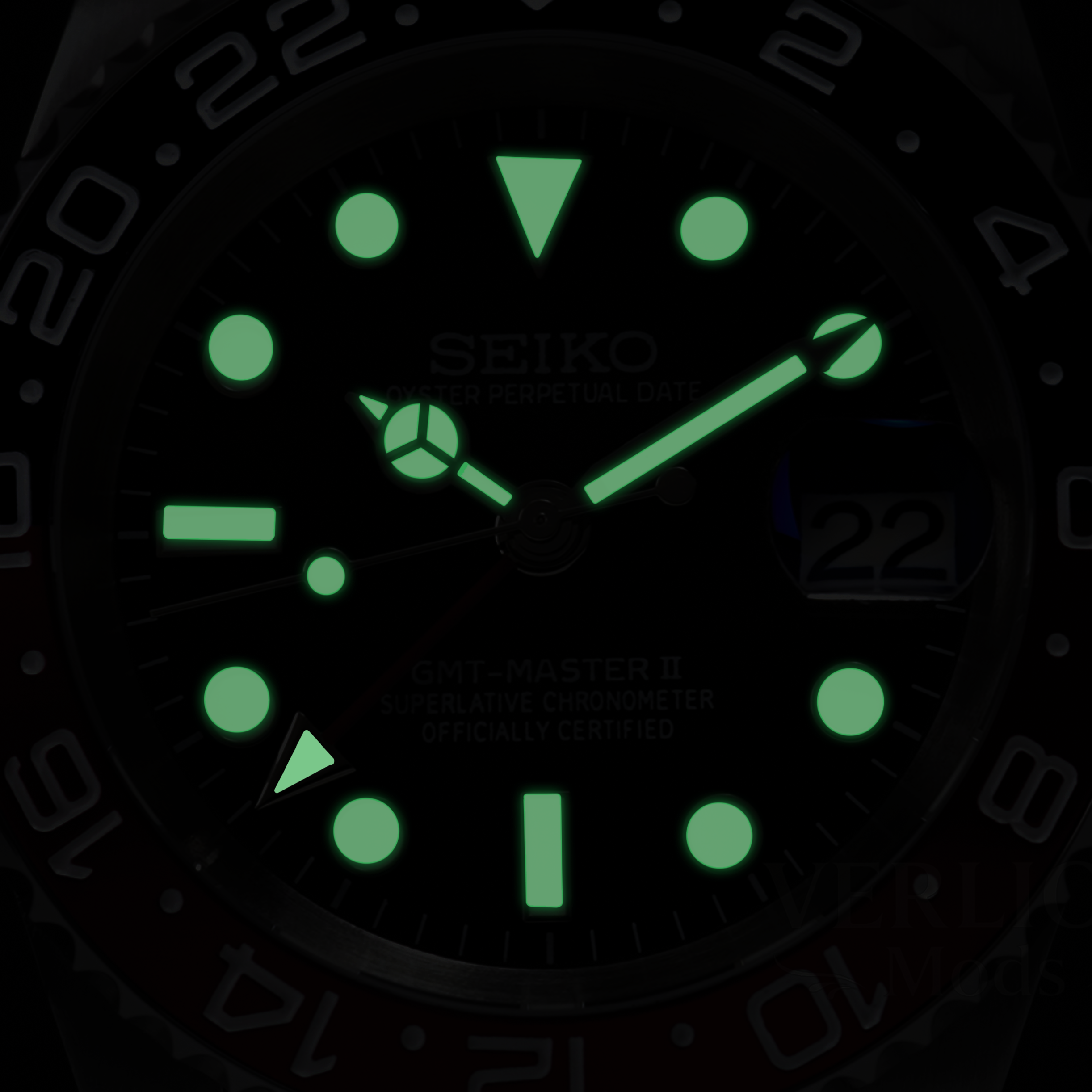 Luminous dial detail on automatic GMT watch