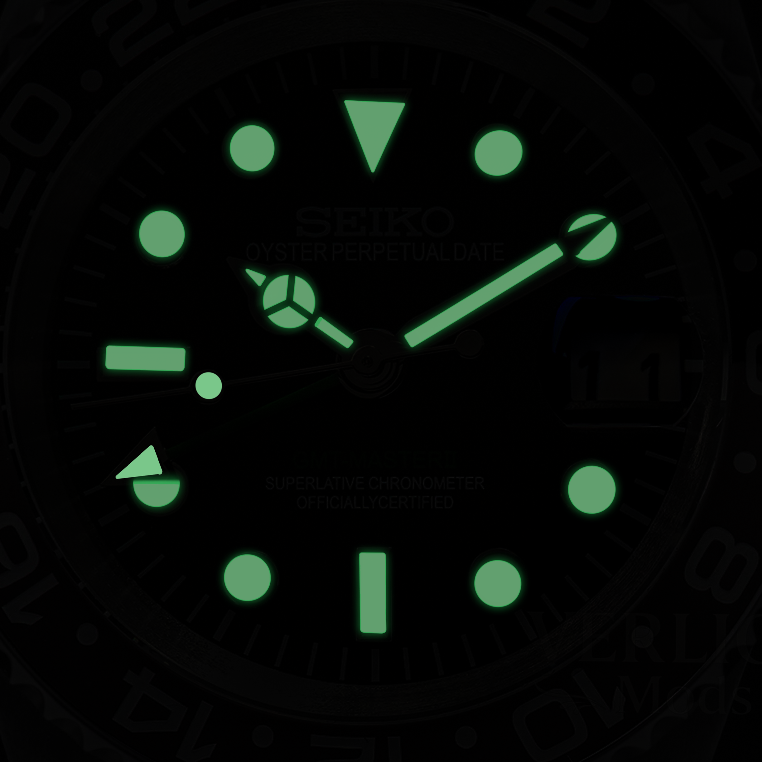 Luminous dial detail on automatic GMT watch